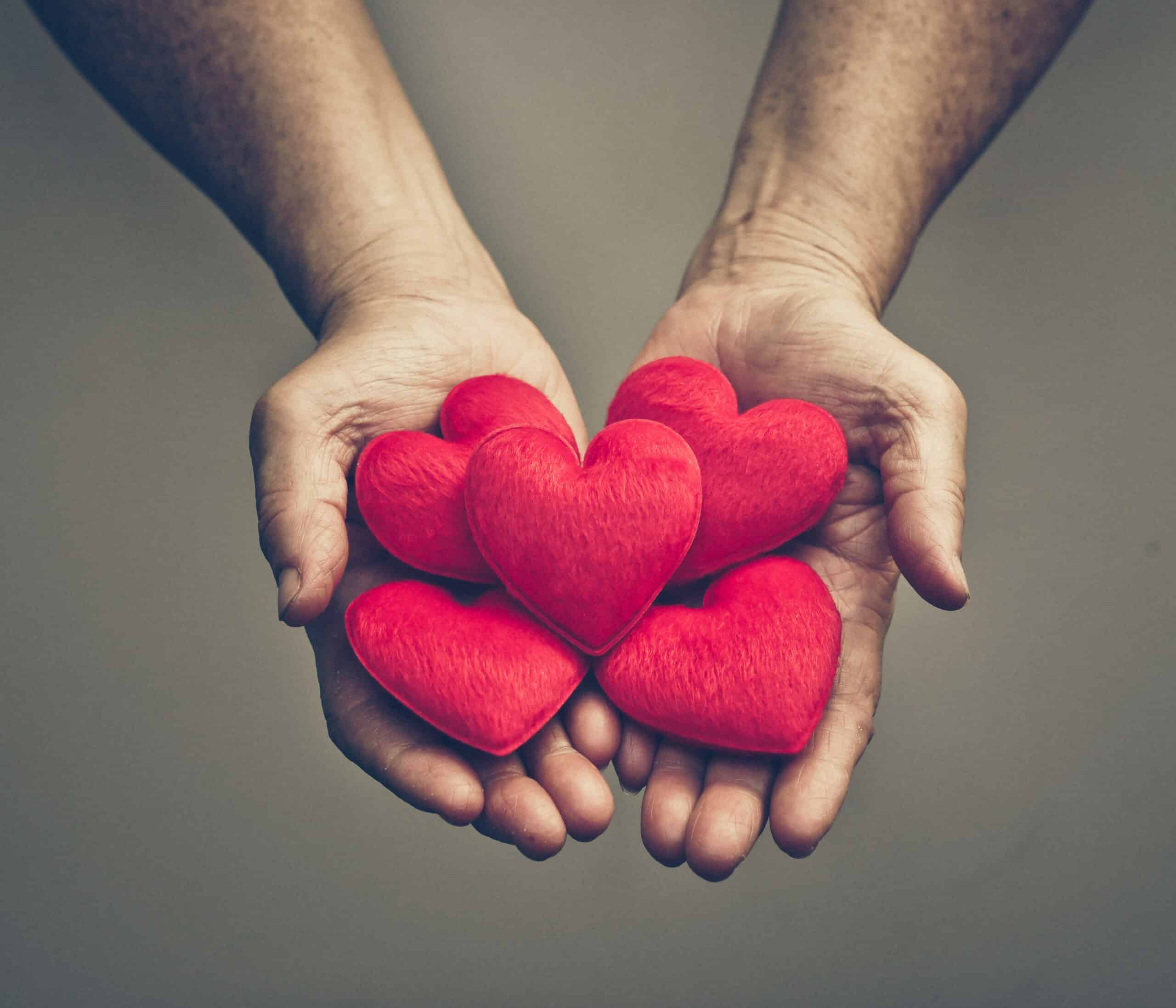 Hands offering five red felt hearts. Post title: How to Update Your Beneficiaries on your lpl accounts
