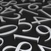 Numbers laying on the ground. Article title: CPI Rises in June as Consumers Keep Spending