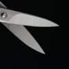 Scissors. Article title: Powell Hinted at September Rate Cut, Markets React