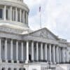 Capitol building. Article title: Markets Hit Record Highs Despite Government Shutdown